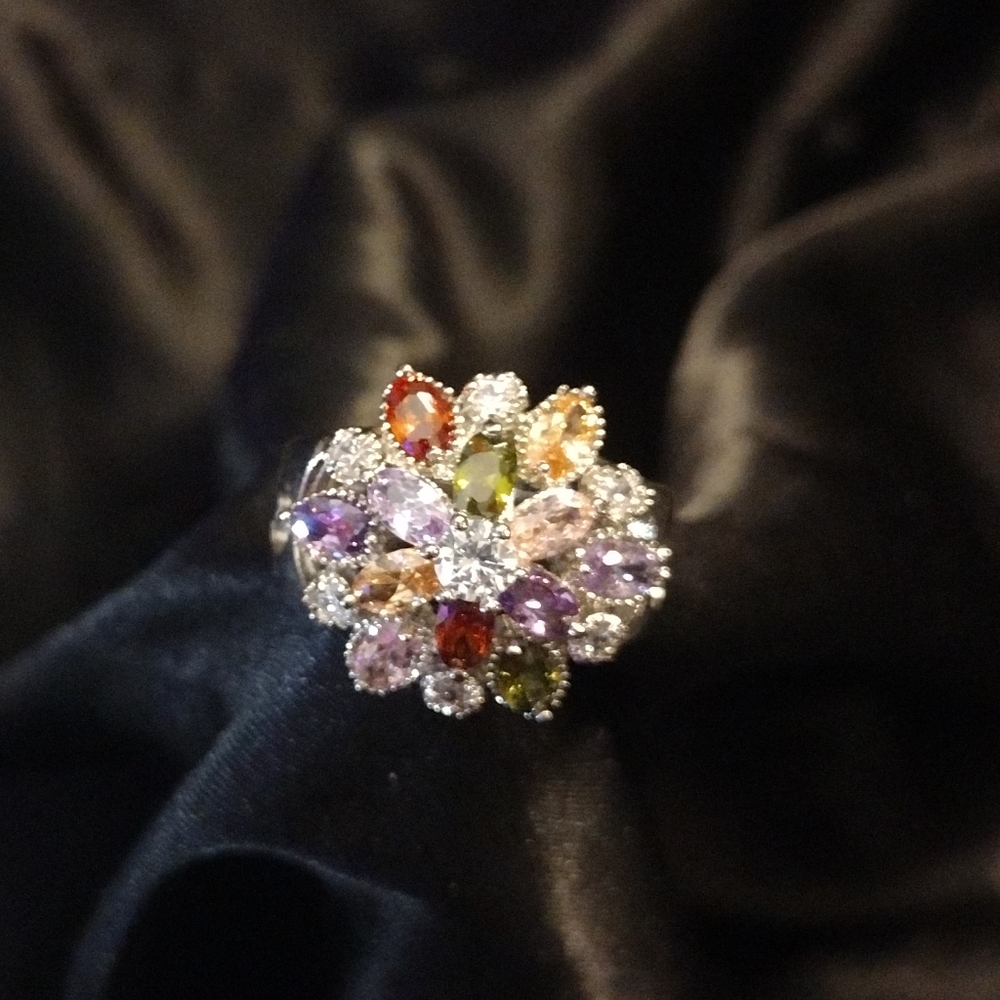 Beautiful silver cluster ring of many different precious stones